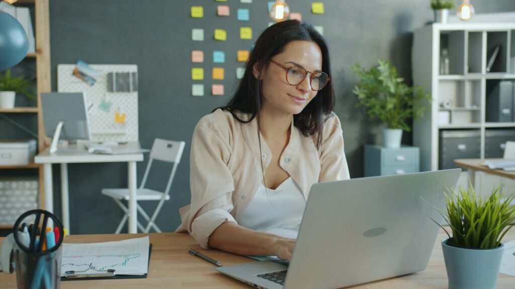 Broker working at a laptop